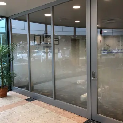Frosted privacy film with a custom pattern applied to office glass (example 12)