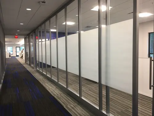 Frosted privacy film with a custom pattern applied to office glass (example 6)
