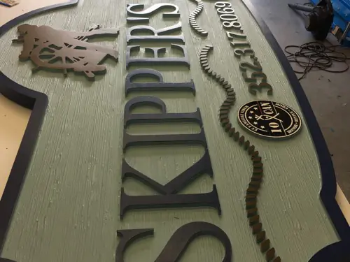 Sandblasted dimensional sign with raised lettering made by Cardinal Signs (example 6)