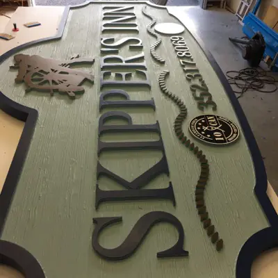 Sandblasted dimensional sign with raised lettering made by Cardinal Signs (example 6)