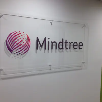 Acrylic lobby panel mounted on polished standoff hardware (example 4)